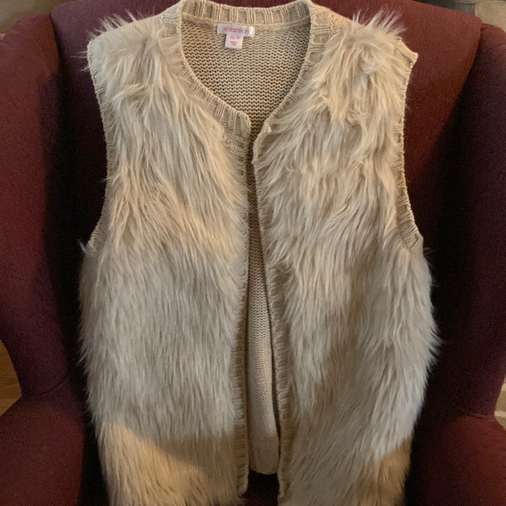 Cream colored faux fur vest